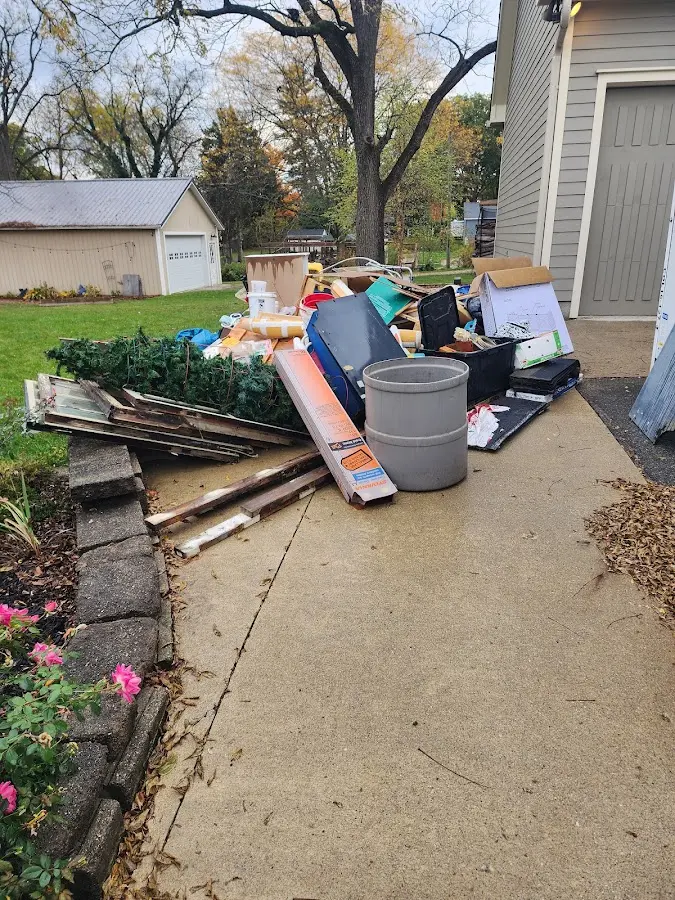 Dumpster being loaded with debris for Residential Dumpster Rental in Upland